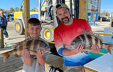 Father and son after a fishing charter in Panama Beach