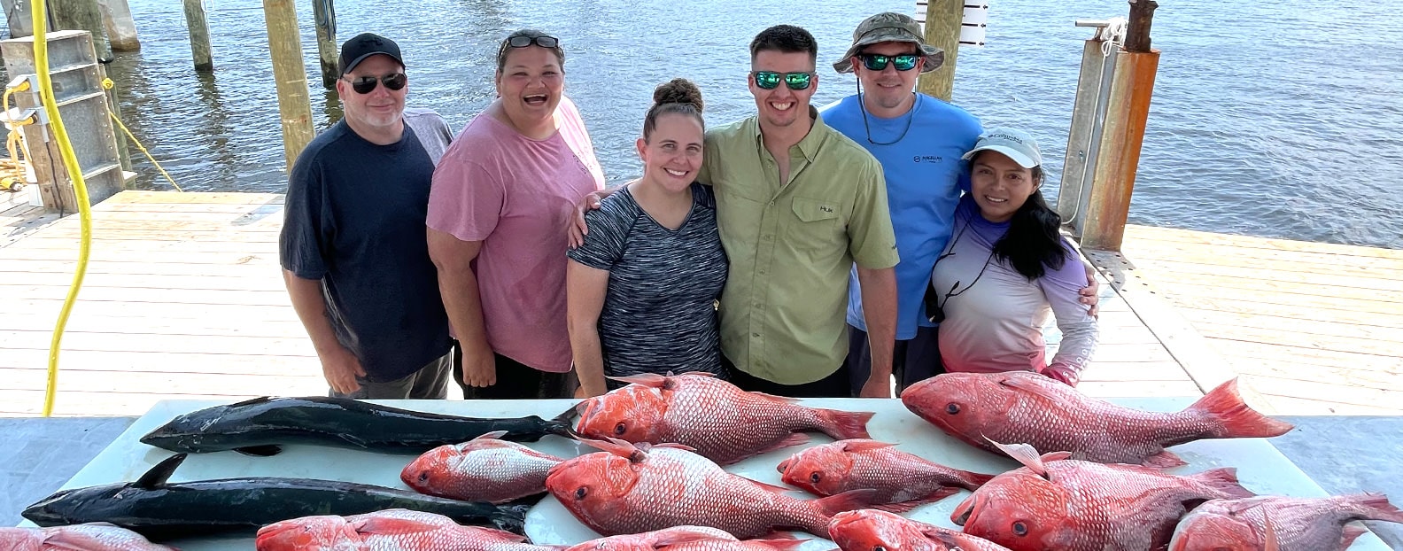 Couples after fishing charter trip in Orange Beach Alabama